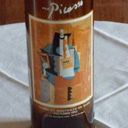 Glass and bottle of suze picasso