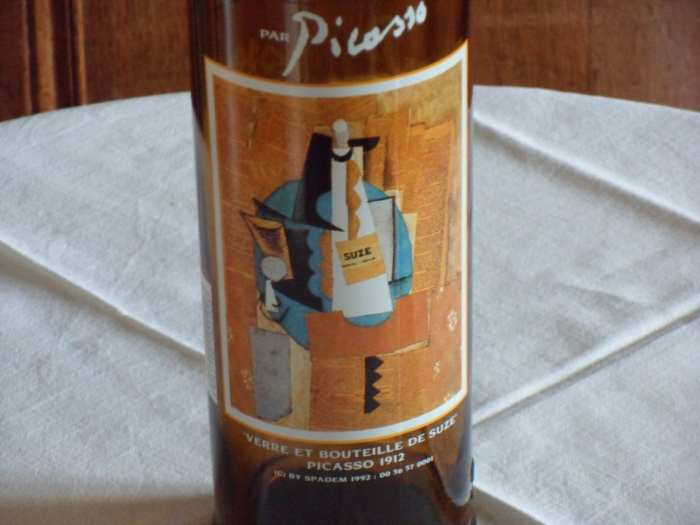 Glass and bottle of suze picasso